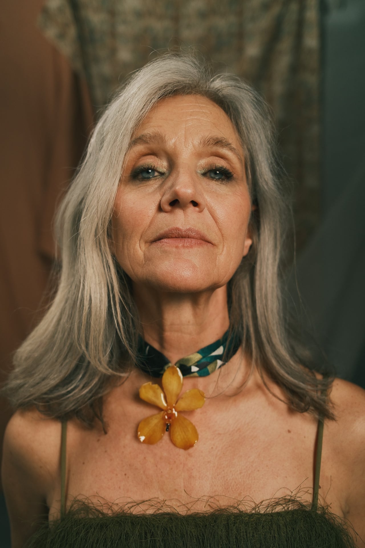 Yellow orchid on green scarf