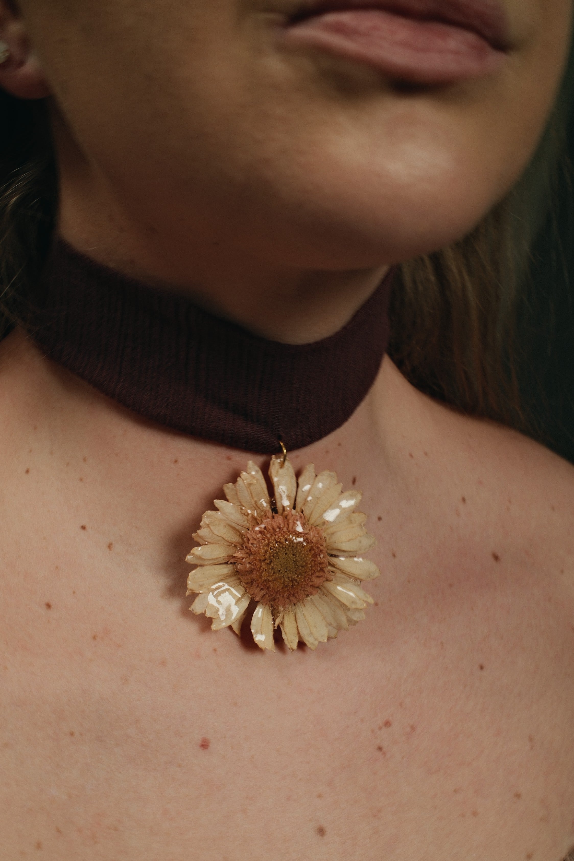 midsize gerbara on bordeaux cotton choker.