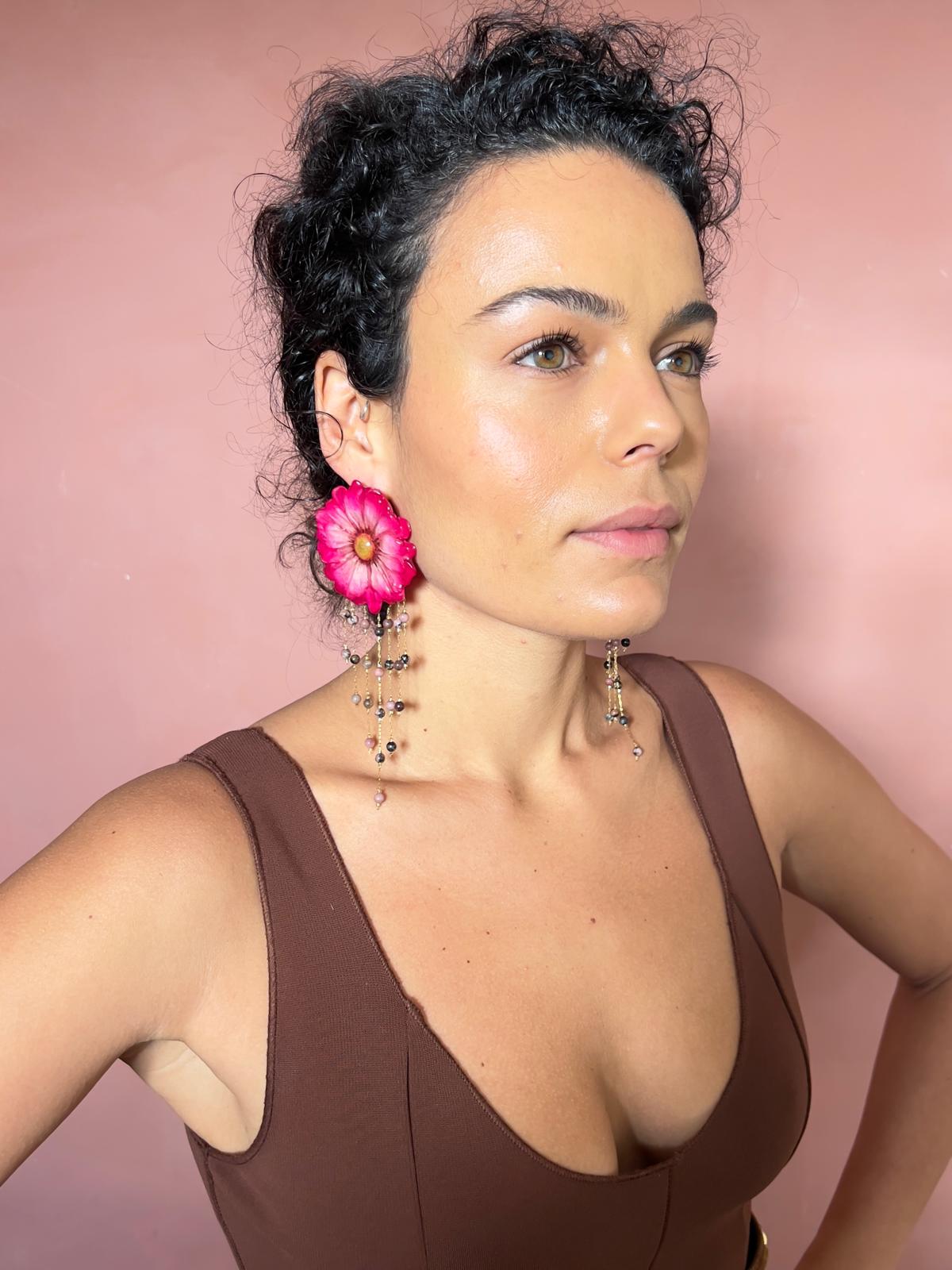 White daisy accented with pink resin and dangling threads with beads