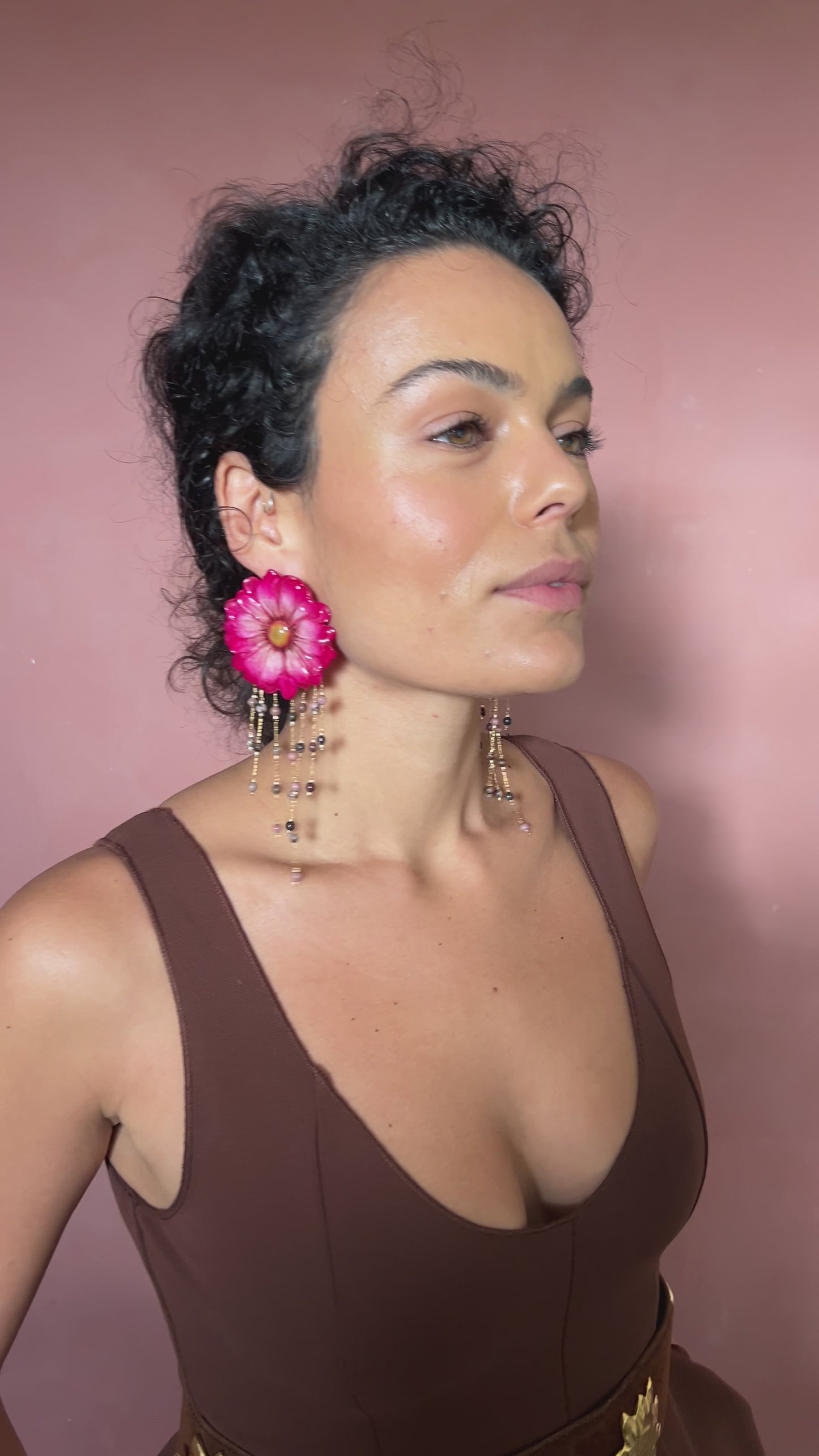White daisy accented with pink resin and dangling threads with beads